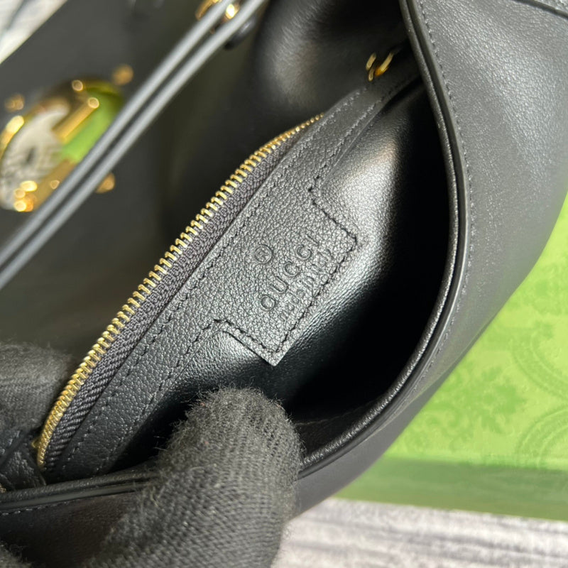 Side profile of elevated signature women's handbag – women's designer-style accessory