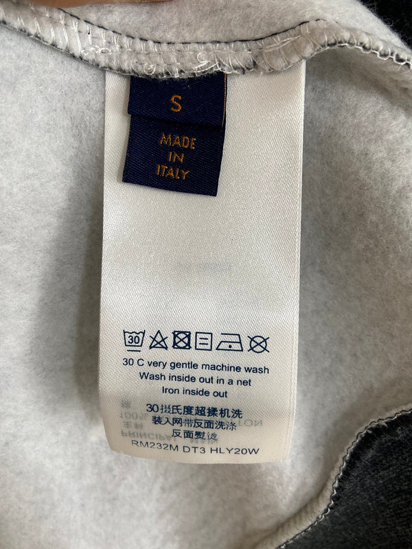 Side profile of Louis Vuitton luxury clothing with label-forward styling