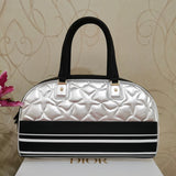 Close-up detail of polished structured women's handbag – women's everyday handbag
