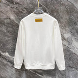 Side profile of Louis Vuitton luxury clothing with label-forward styling