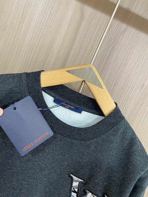 Full styled look of Louis Vuitton luxury clothing with label-forward styling