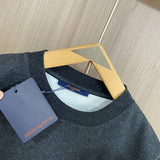 Full styled look of Louis Vuitton luxury clothing with label-forward styling