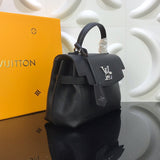 Close-up detail of polished signature women's handbag – women's designer-style accessory