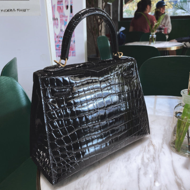 Side view of sculpted structured handbag