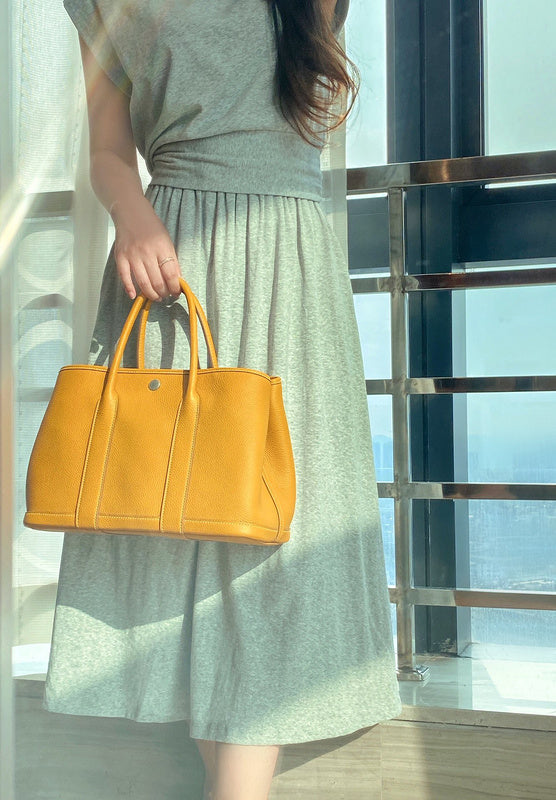 Side view of versatile structured handbag