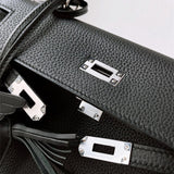  timeless top-handle bag styled with outfit