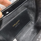  Structured crossbody bag carried on shoulder