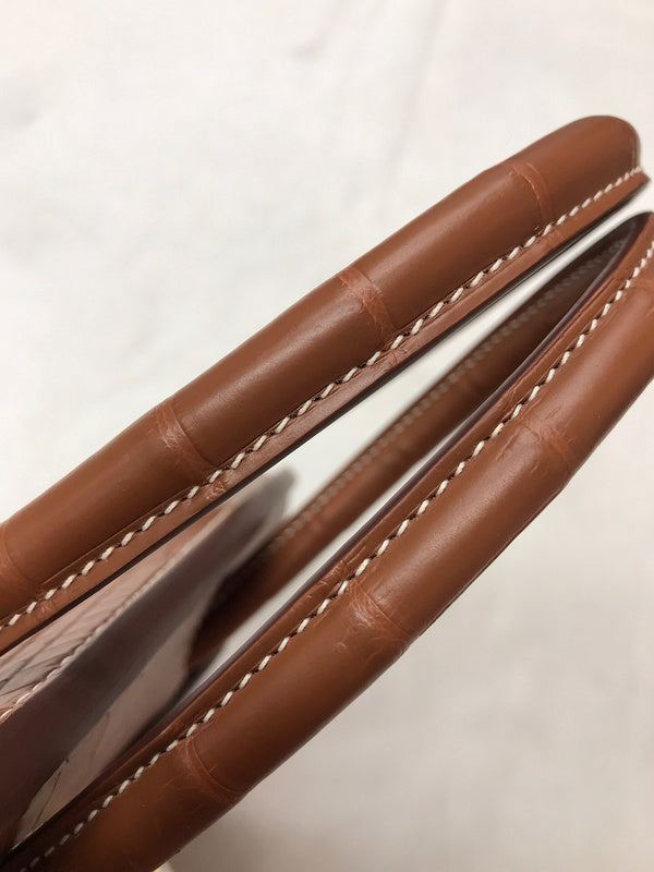Side view of curated structured handbag