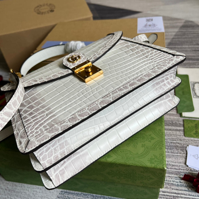 Styled lifestyle shot of structured classic women's handbag – women's premium purse