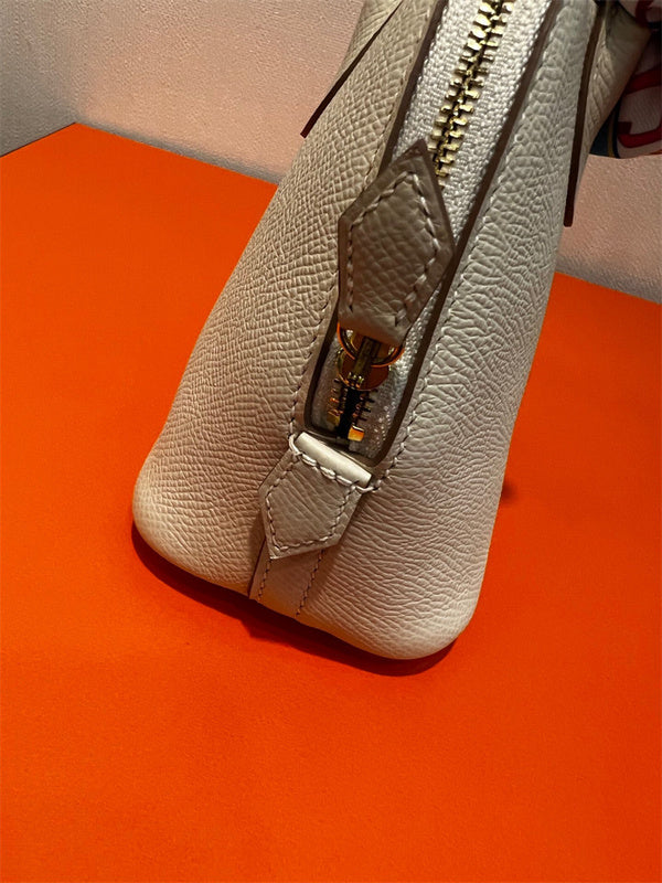  Minimalist top-handle bag carried on shoulder