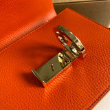 Styled lifestyle shot of structured polished women's handbag – women's luxury accessory