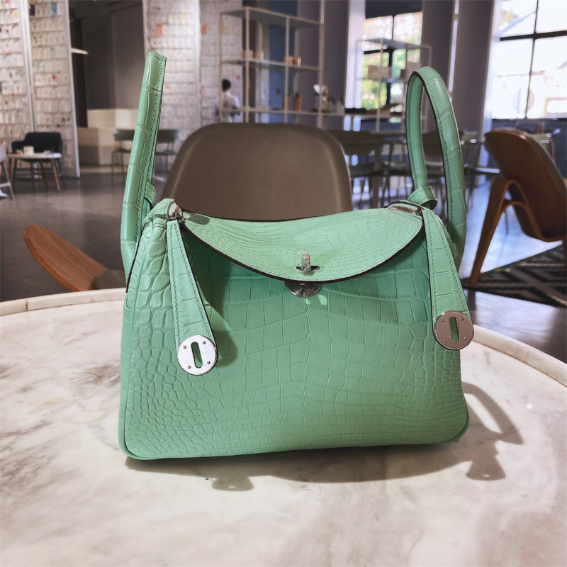  Sleek structured bag carried on shoulder 16