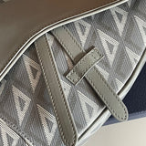 Handle and strap detail of sleek polished women's handbag – women's luxury accessory