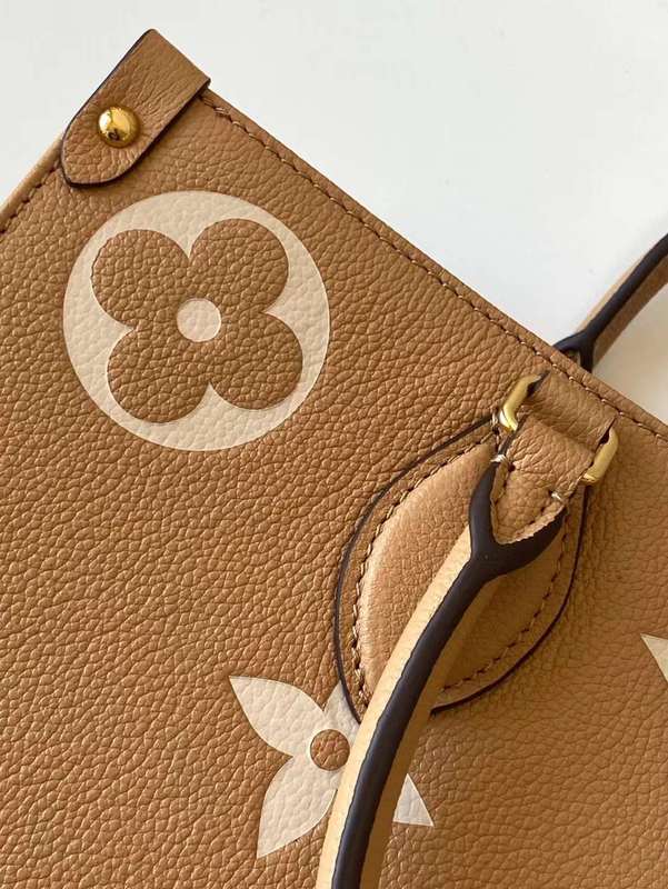 Handle and strap detail of classic structured women's handbag – women's designer-style accessory