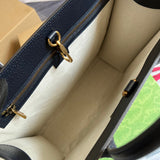 Side profile of signature everyday-luxe women's handbag – women's designer-style accessory