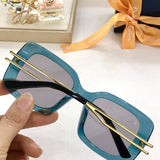 Close-up detail view of Louis Vuitton unisex sunglasses