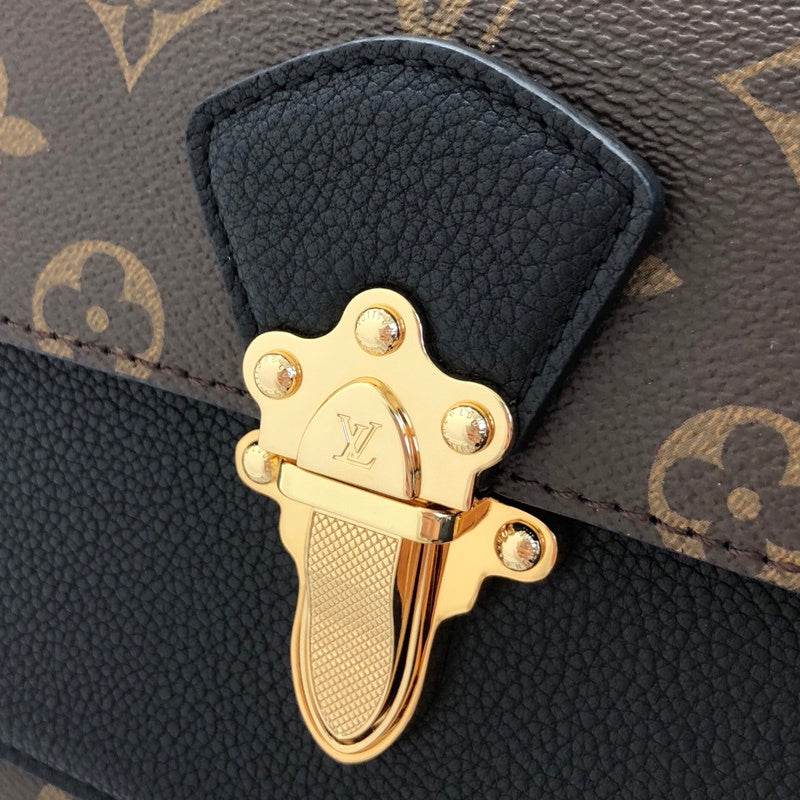 Handle and strap detail of statement refined women's handbag – women's designer-style accessory