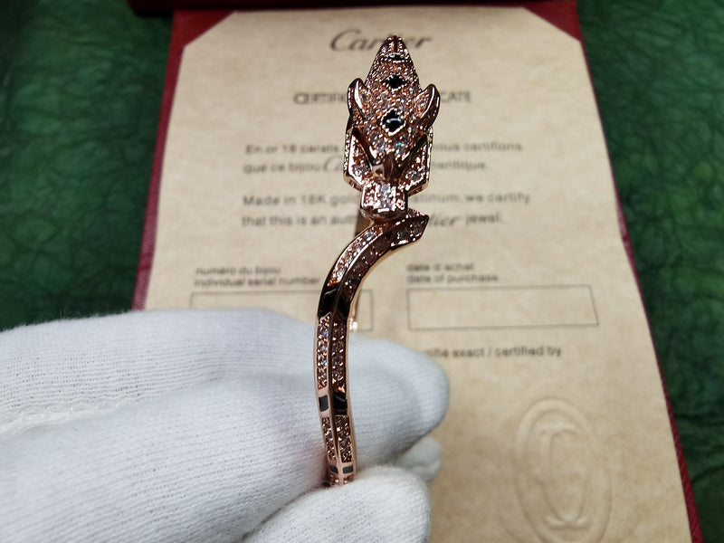 Close-up detail view of Cartier unisex jewelry piece