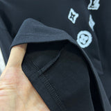 Side profile of Louis Vuitton luxury clothing with logo-detail design