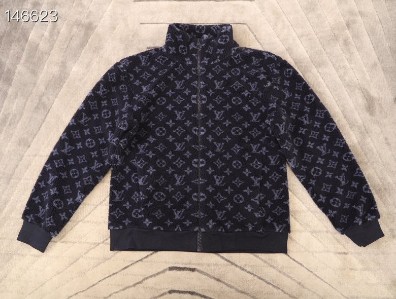 Flat lay presentation of Louis Vuitton luxury clothing with tailored silhouette