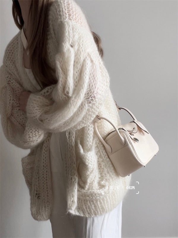 Side view of sculpted structured handbag