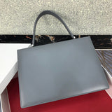 Styled lifestyle shot of signature elevated women's handbag – women's luxury handbag