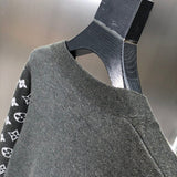 Side profile of Louis Vuitton luxury clothing with signature branding