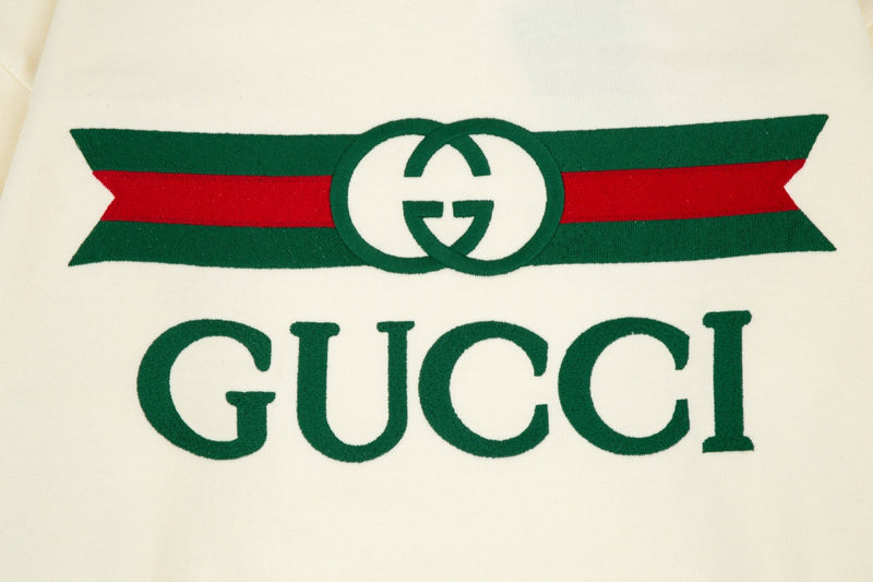 Flat lay presentation of Gucci luxury clothing with contemporary cut