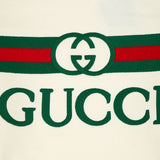 Flat lay presentation of Gucci luxury clothing with contemporary cut