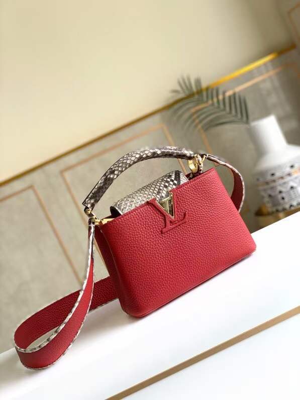 Front view of elevated polished women's handbag – women's luxury handbag