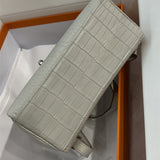 Side view of effortless structured handbag