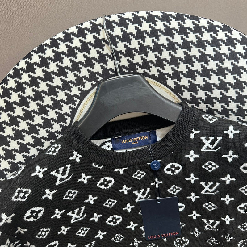 Close-up detail shot of Louis Vuitton luxury clothing with label-forward styling