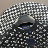 Close-up detail shot of Louis Vuitton luxury clothing with label-forward styling