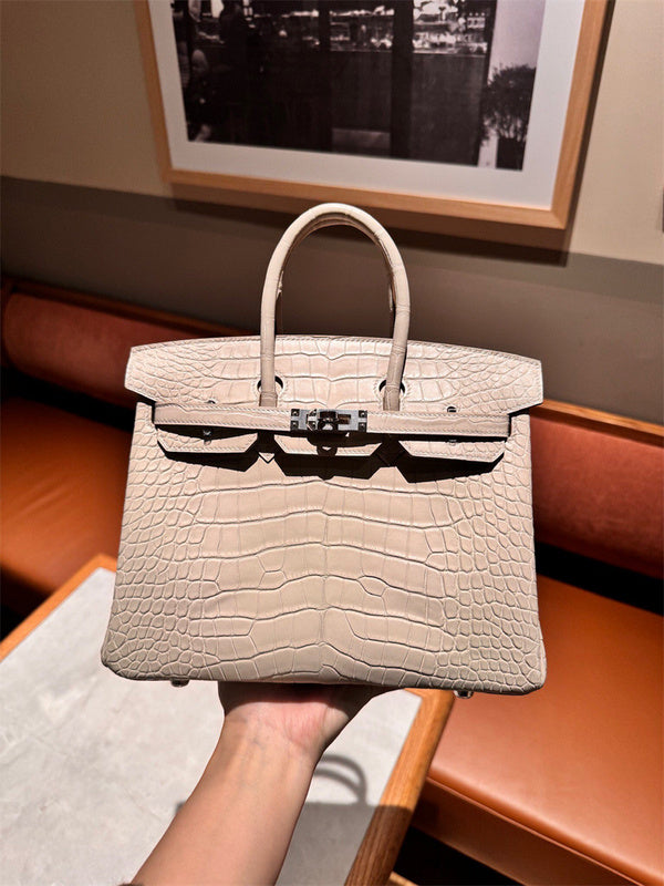 Side view of sculpted structured handbag