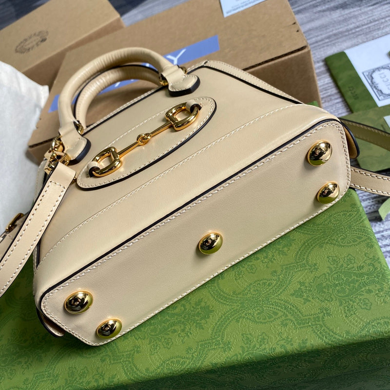 Handle and strap detail of structured modern women's handbag – women's designer-style accessory