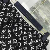 Flat lay presentation of Louis Vuitton cotton t-shirt with label-forward styling