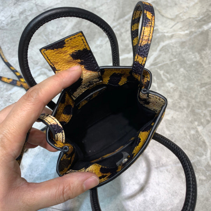 Modern Faux Leather Handbag - Signature Hardware Accents | Women's Statement Accessory #1050 - styled full view (image 7) of designer-inspired handbag