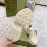 Side profile of Gucci classic monochrome sneakers retro runner design