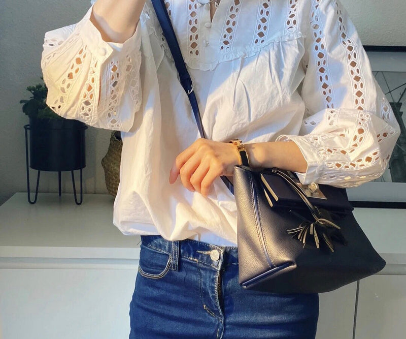Side view of minimalist structured handbag
