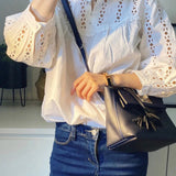 Side view of minimalist structured handbag