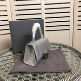 Styled lifestyle shot of modern classic women's handbag – women's luxury accessory