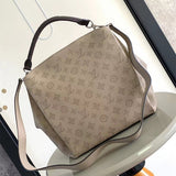  timeless top-handle bag styled with outfit