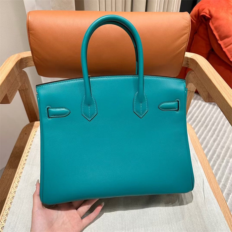 Side view of contemporary structured handbag