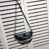 Styled lifestyle shot of sleek structured women's handbag – women's luxury handbag