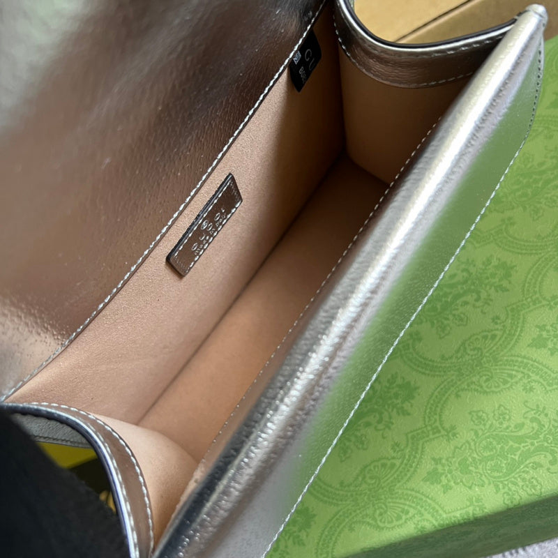 Side profile of statement sleek women's handbag – women's designer-style accessory