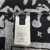 Close-up detail shot of Louis Vuitton luxury clothing with runway-inspired design