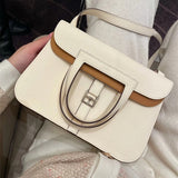  Clean-Lined top-handle bag carried on shoulder 16