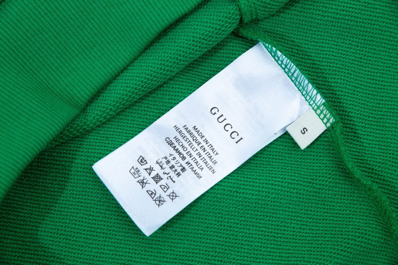 Close-up detail shot of Gucci luxury clothing with relaxed-fit cut