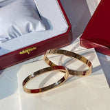 Side view of Cartier unisex jewelry piece