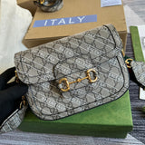 Handle and strap detail of classic signature women's handbag – women's designer-style accessory